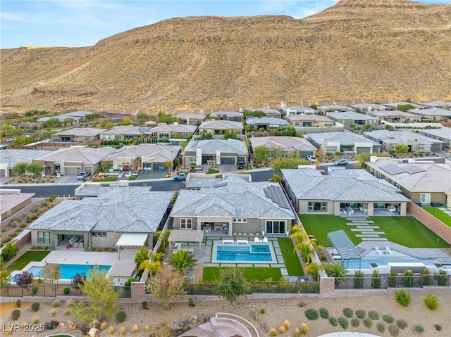 birds eye view of property featuring a mountain view