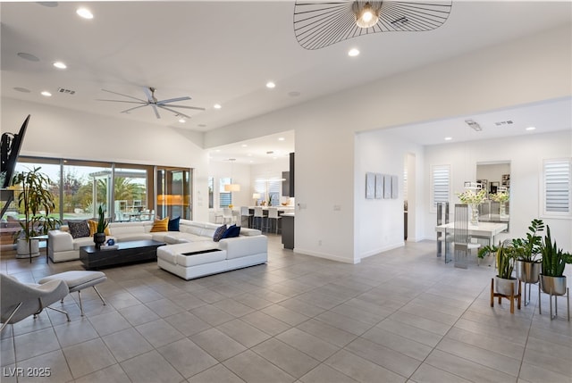 tiled living room featuring ceiling fan