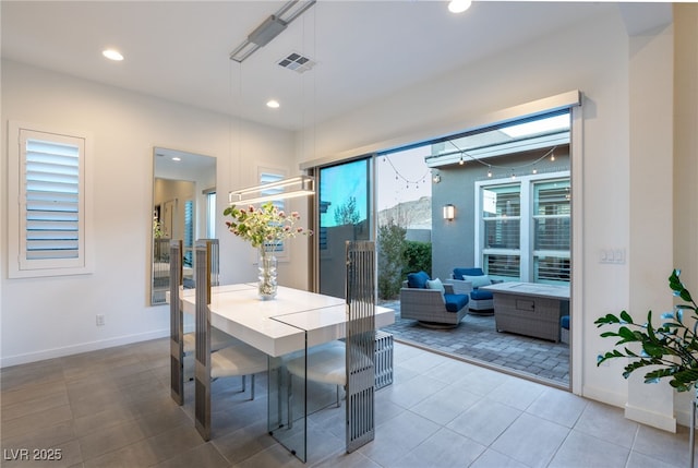 dining area featuring tile patterned floors