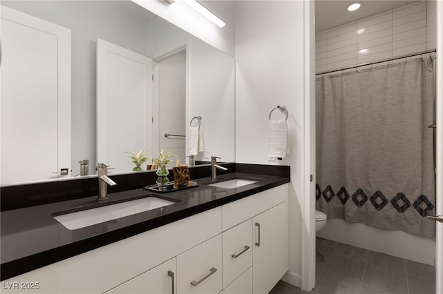 bathroom with vanity, tile patterned floors, and toilet