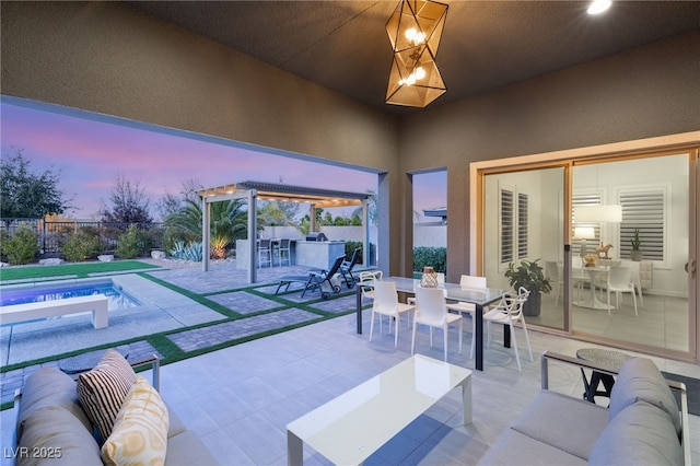 patio terrace at dusk with an outdoor living space and an outdoor bar