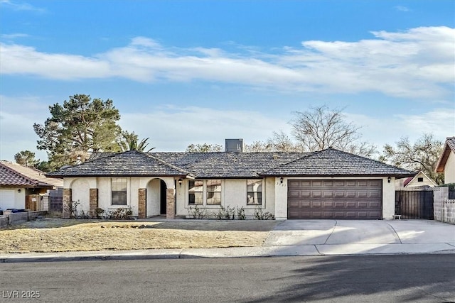 ranch-style home featuring a garage