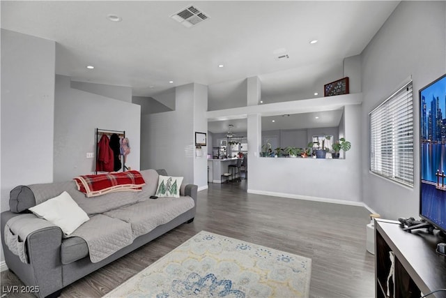 living room featuring dark wood-type flooring