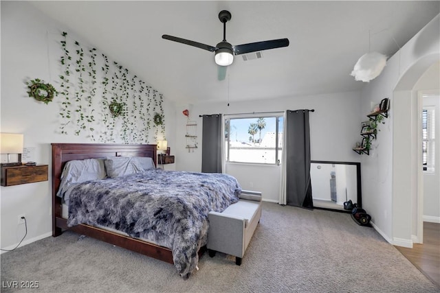 carpeted bedroom featuring ceiling fan and vaulted ceiling