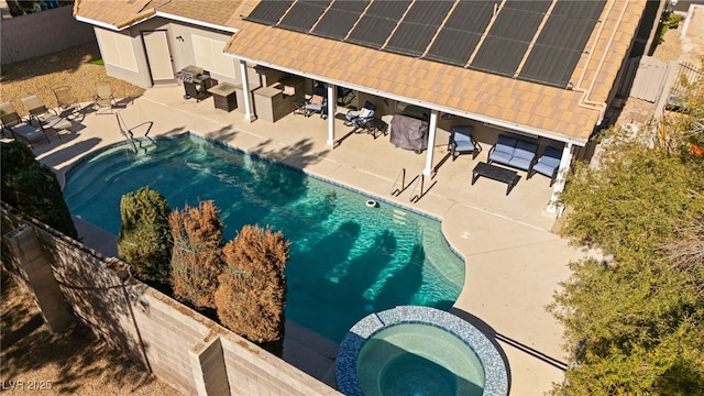 view of pool featuring an in ground hot tub, an outdoor hangout area, and a patio area