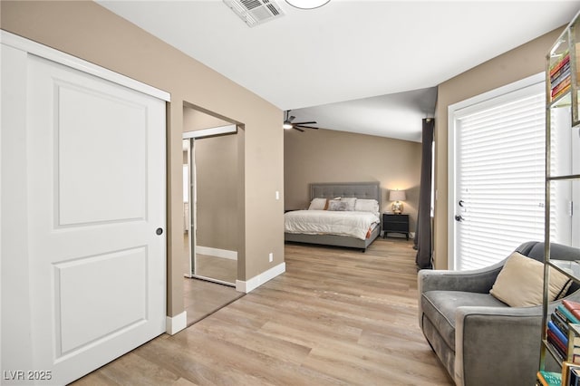 bedroom featuring light hardwood / wood-style flooring and vaulted ceiling