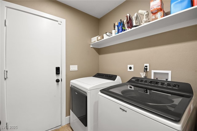 laundry room with washer and clothes dryer