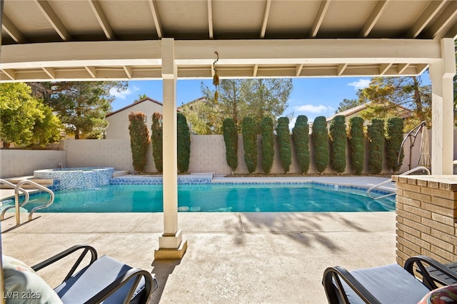 view of swimming pool with an in ground hot tub and a patio