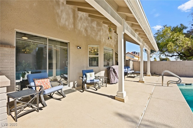 view of patio featuring a fenced in pool