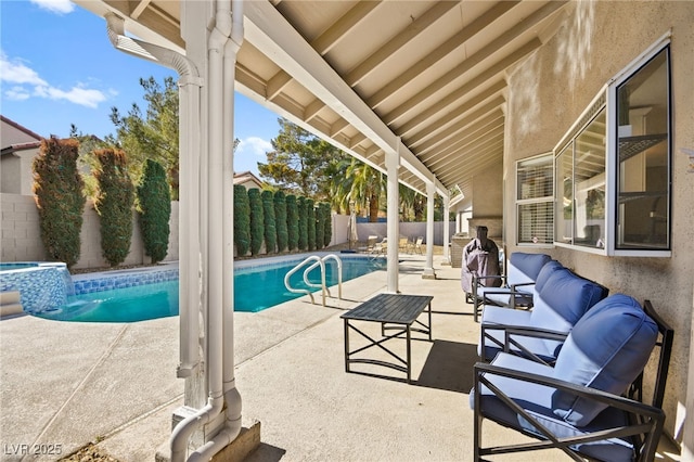 view of pool featuring a patio