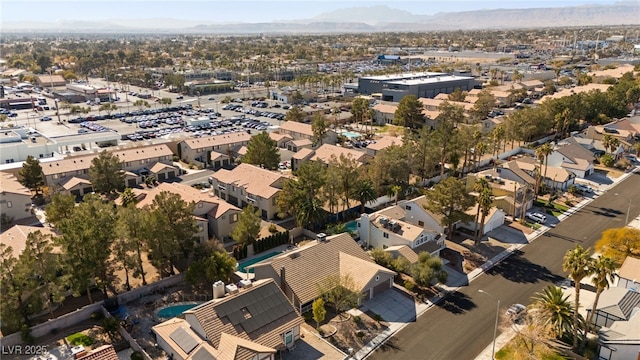 birds eye view of property with a mountain view