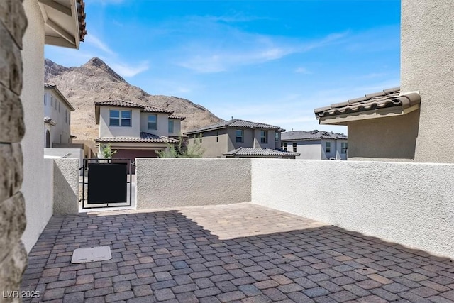 view of patio / terrace featuring a mountain view