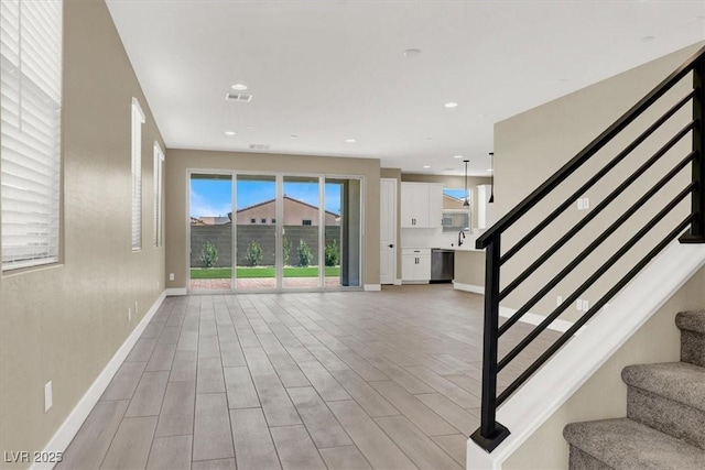 interior space featuring sink and light hardwood / wood-style flooring