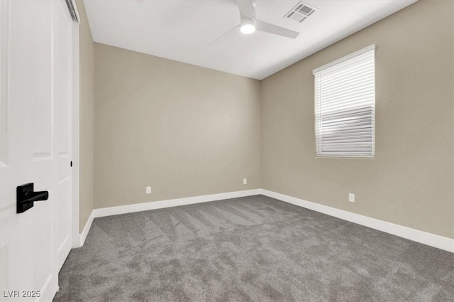 unfurnished room featuring ceiling fan and carpet