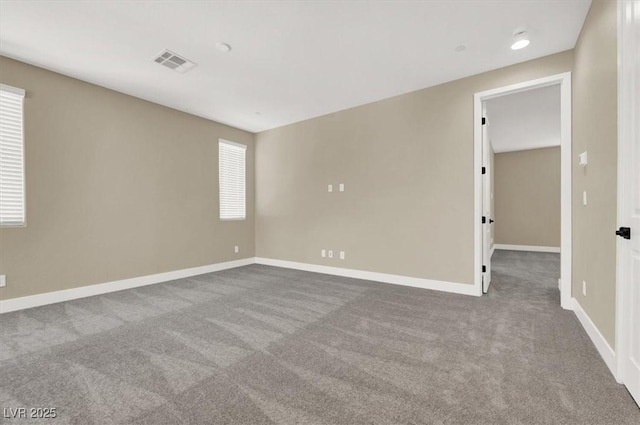 unfurnished room with plenty of natural light and light colored carpet