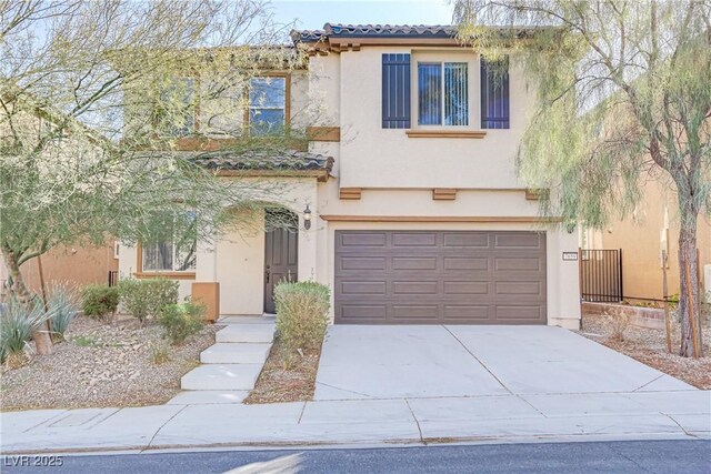 7659 Dewy Falls Ave, Las Vegas, NV 89179 - mediterranean / spanish-style home featuring a tiled roof, a garage, stucco siding, and concrete driveway
