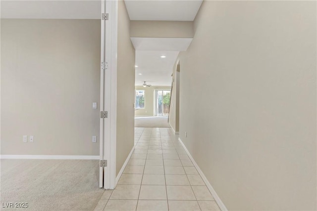 corridor featuring light tile patterned floors