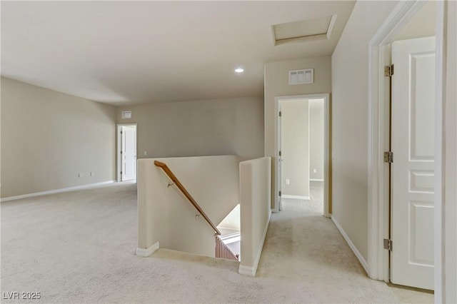 corridor with light colored carpet