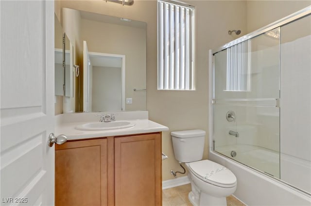 full bathroom featuring vanity, combined bath / shower with glass door, and toilet