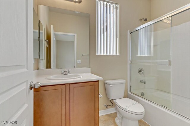 7659 Dewy Falls Ave, Las Vegas, NV 89179 - full bath with toilet, vanity, shower / bath combination with glass door, tile patterned floors, and baseboards