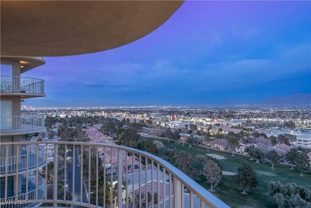 view of balcony at dusk