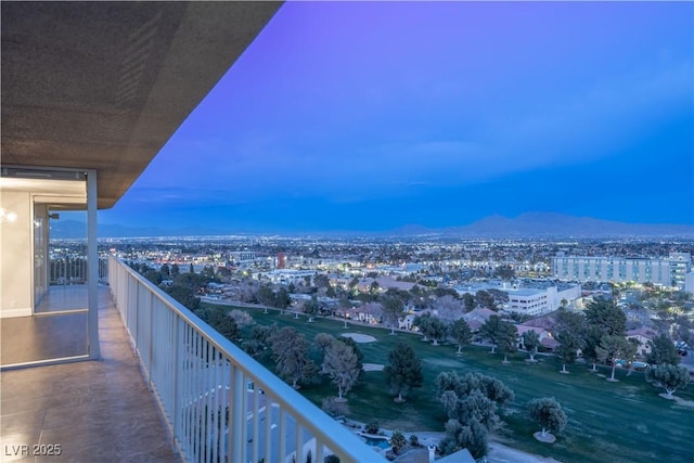 balcony at dusk with a mountain view