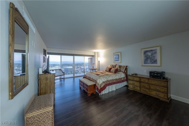 bedroom with dark hardwood / wood-style flooring