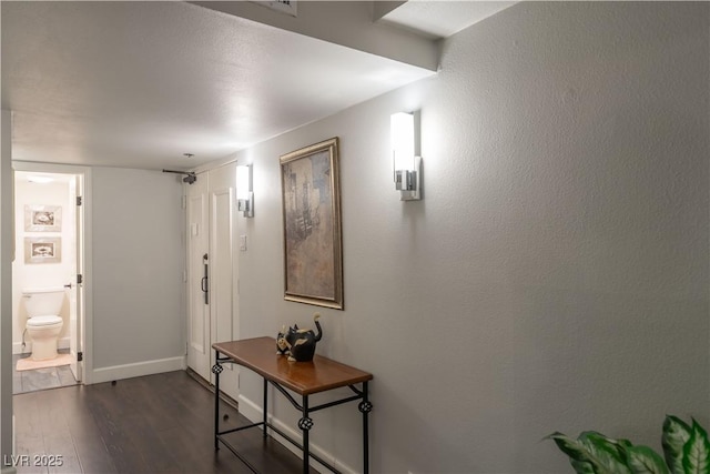 corridor with dark wood-type flooring