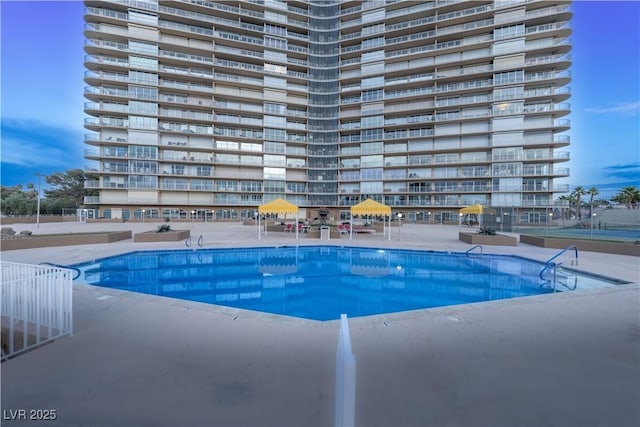 view of swimming pool featuring a patio area