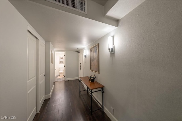 hallway featuring dark hardwood / wood-style flooring