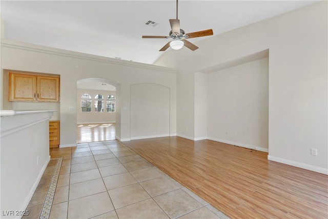 unfurnished living room featuring light hardwood / wood-style floors and ceiling fan