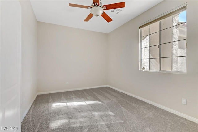 empty room featuring ceiling fan and carpet flooring