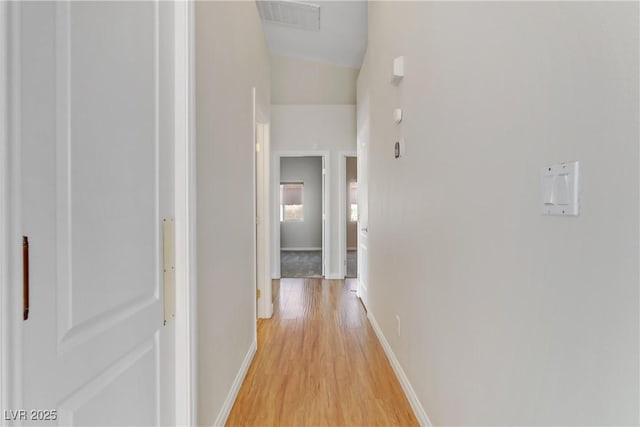 corridor featuring light hardwood / wood-style flooring