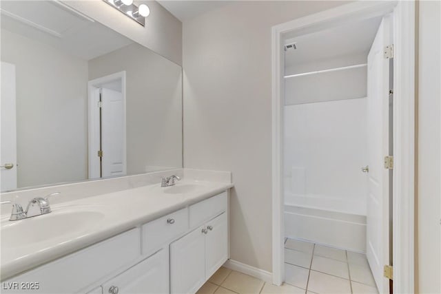 bathroom with tile patterned flooring and vanity