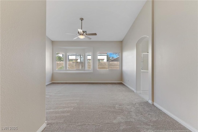 spare room with light colored carpet and ceiling fan