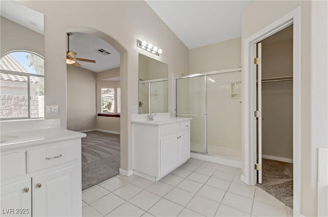 bathroom featuring an enclosed shower, vanity, tile patterned flooring, and ceiling fan