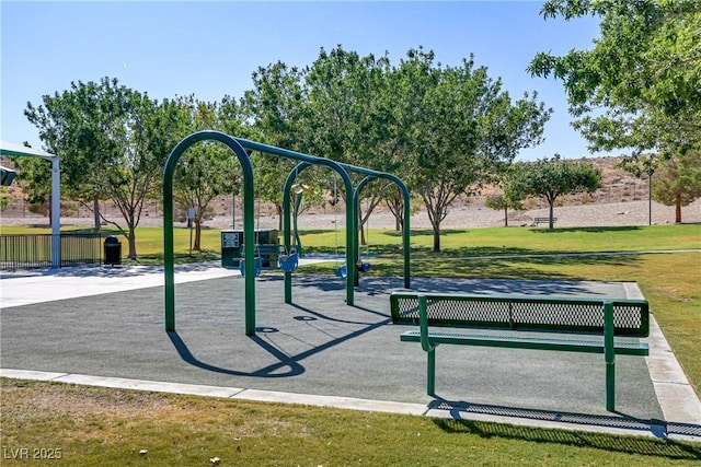 view of property's community with a playground and a lawn