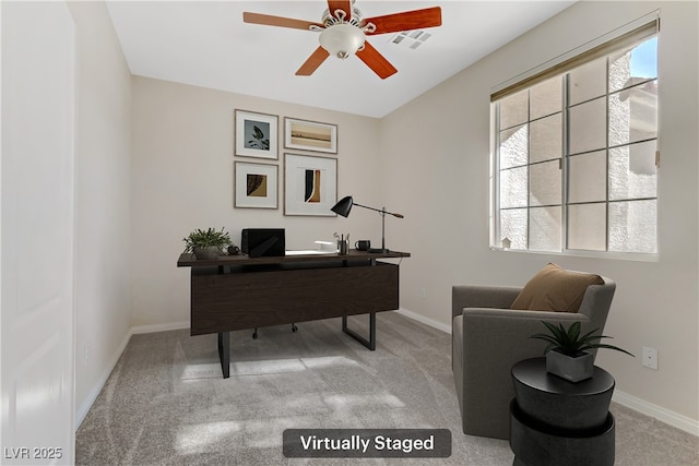 home office featuring carpet and ceiling fan