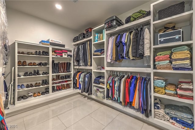 spacious closet featuring tile patterned floors