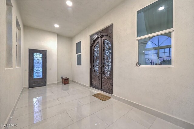 tiled foyer entrance with french doors