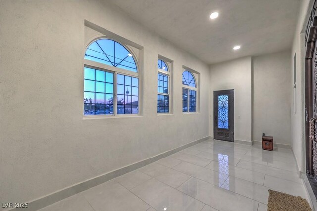 entrance foyer with light tile patterned flooring