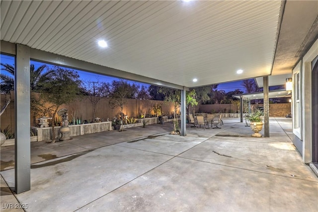 view of patio terrace at dusk