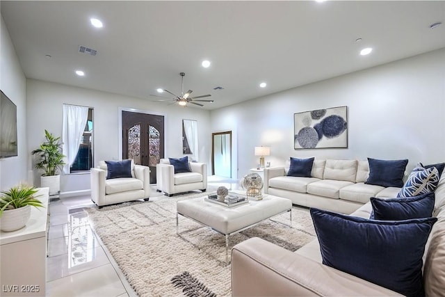 living area featuring ceiling fan, visible vents, french doors, and recessed lighting