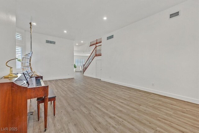 living room featuring light hardwood / wood-style flooring and a wealth of natural light