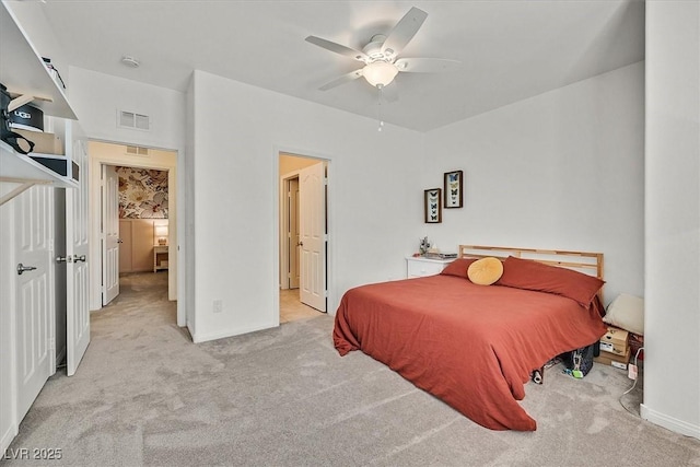 bedroom with light carpet and ceiling fan