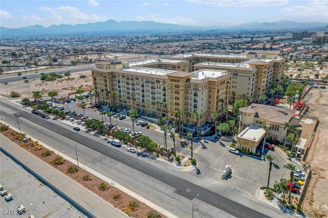 birds eye view of property featuring a mountain view