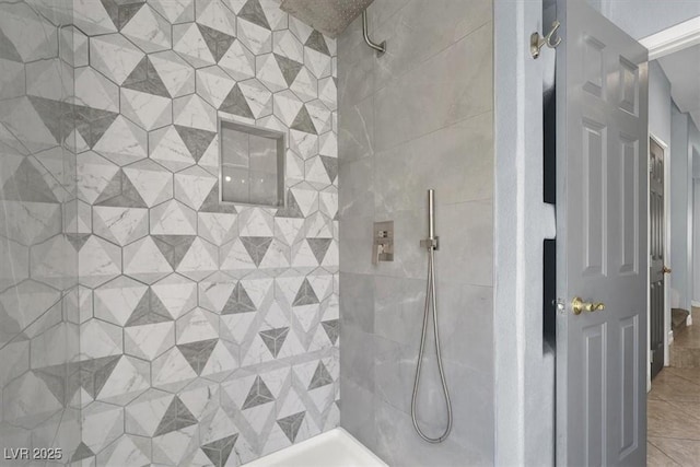 bathroom with a tile shower