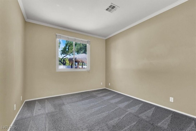 empty room featuring crown molding and carpet