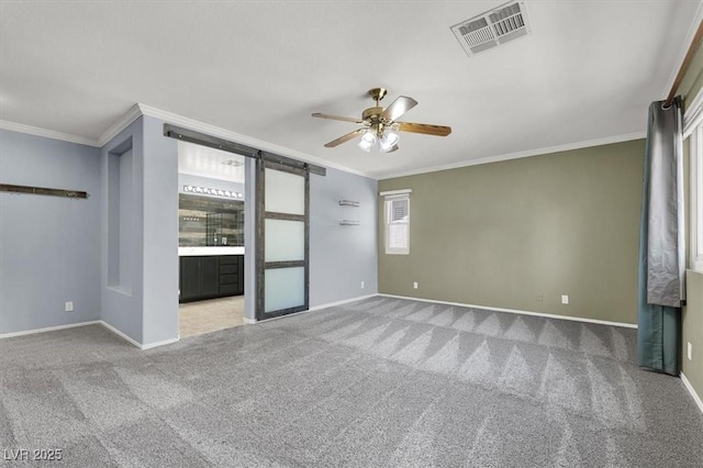 interior space featuring ceiling fan, ornamental molding, and carpet flooring