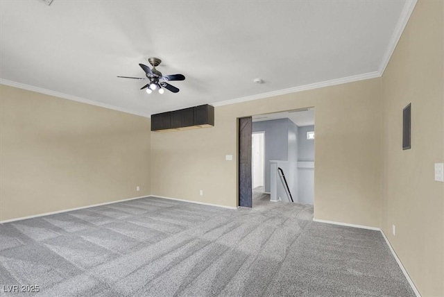 carpeted empty room with crown molding and ceiling fan